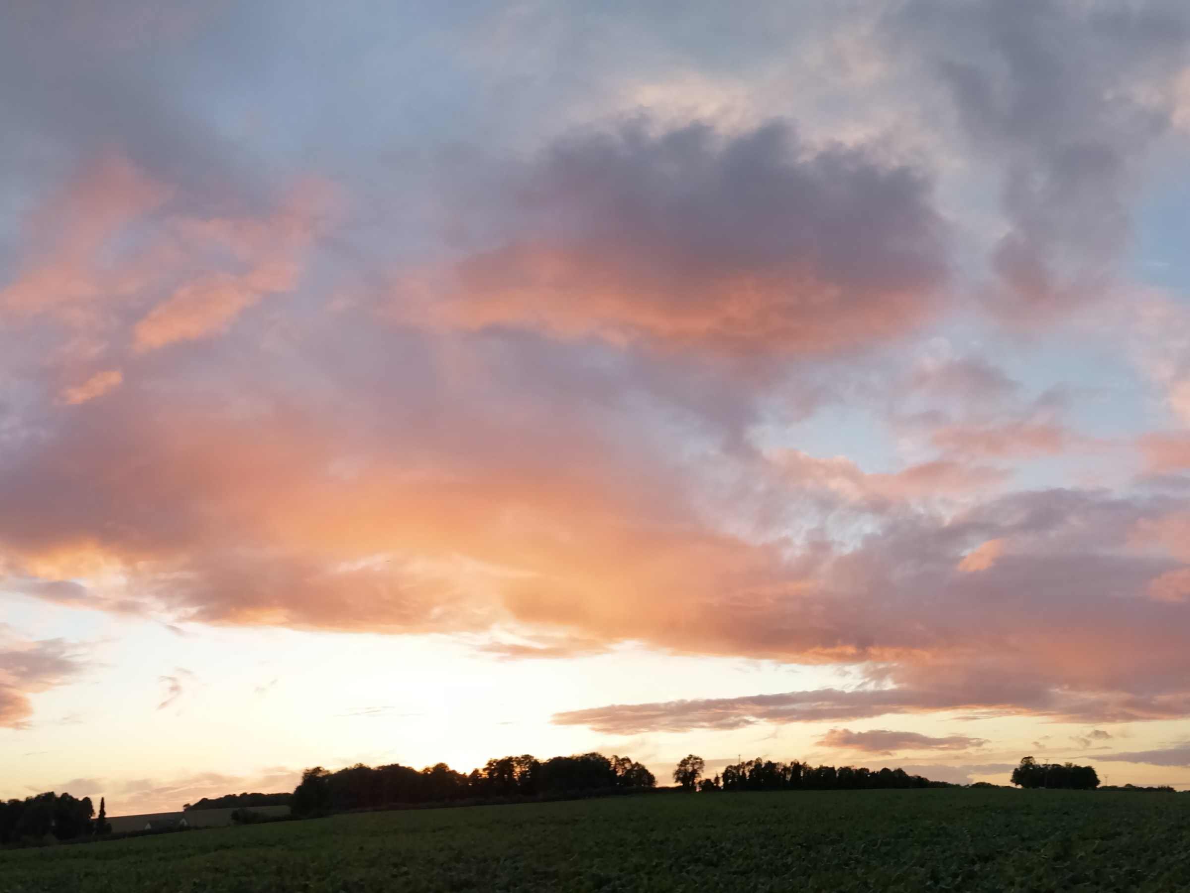 Sun lighting up the clouds, panorama